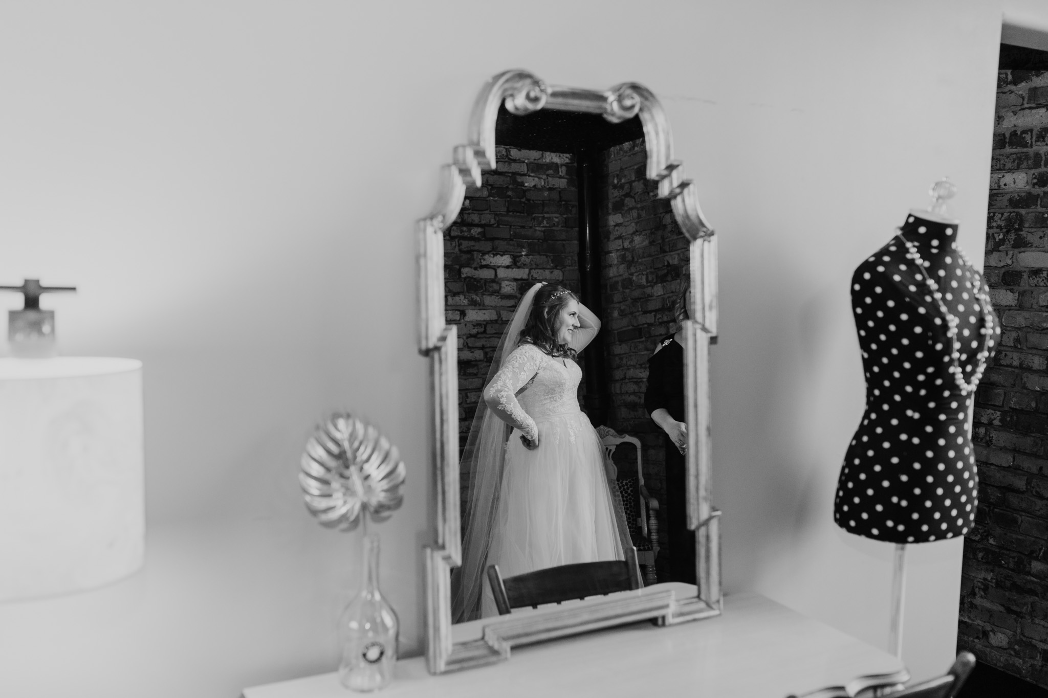 Bride's reflection in the mirror at Ivy House - milwaukee wedding photographer - creative compositions - good lighting - natural colors editing