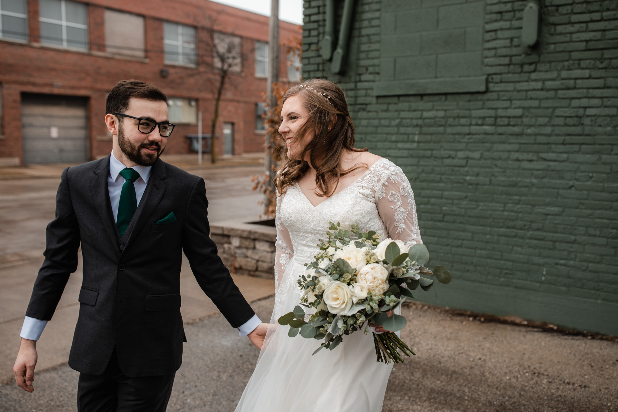 couple laughing wedding day portraits - candid wedding picture with movement