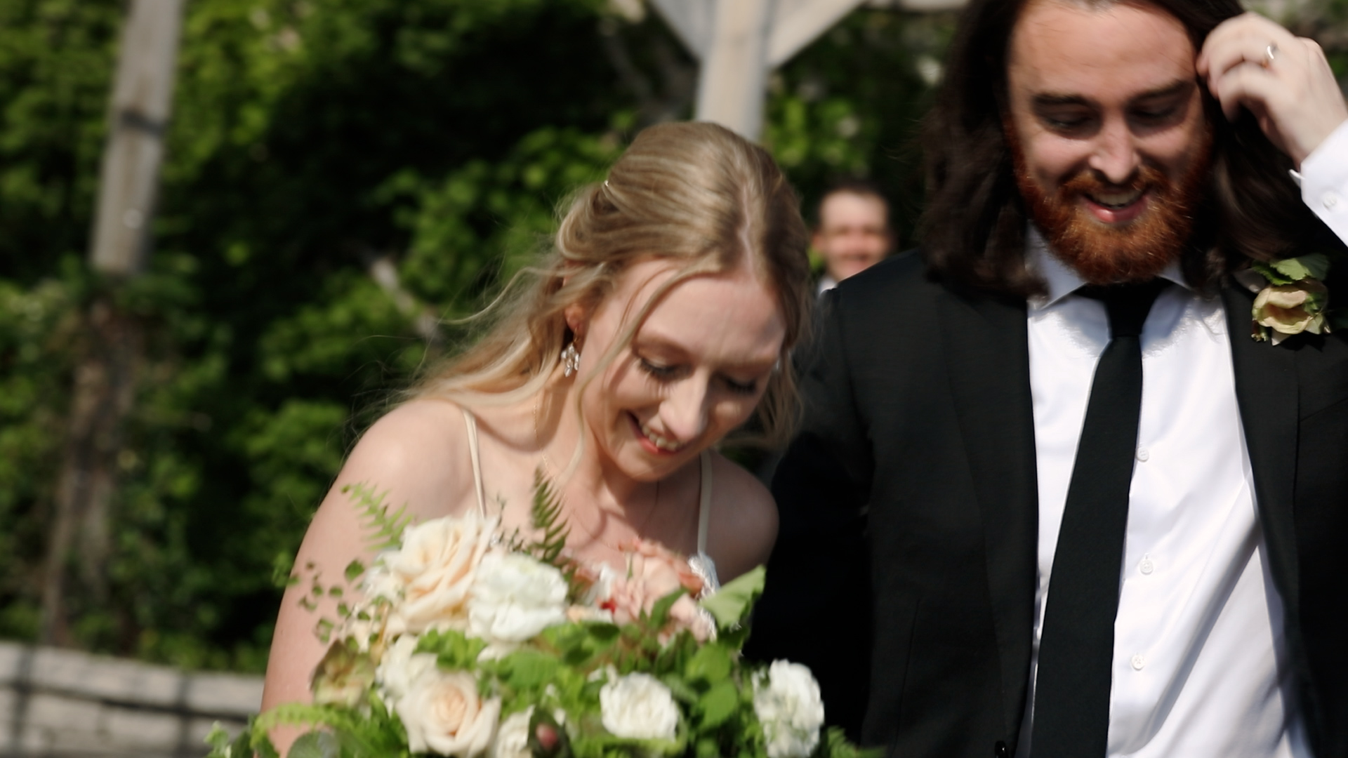 Upbeat grand exit from couple's wedding ceremony - couple coming down the aisle