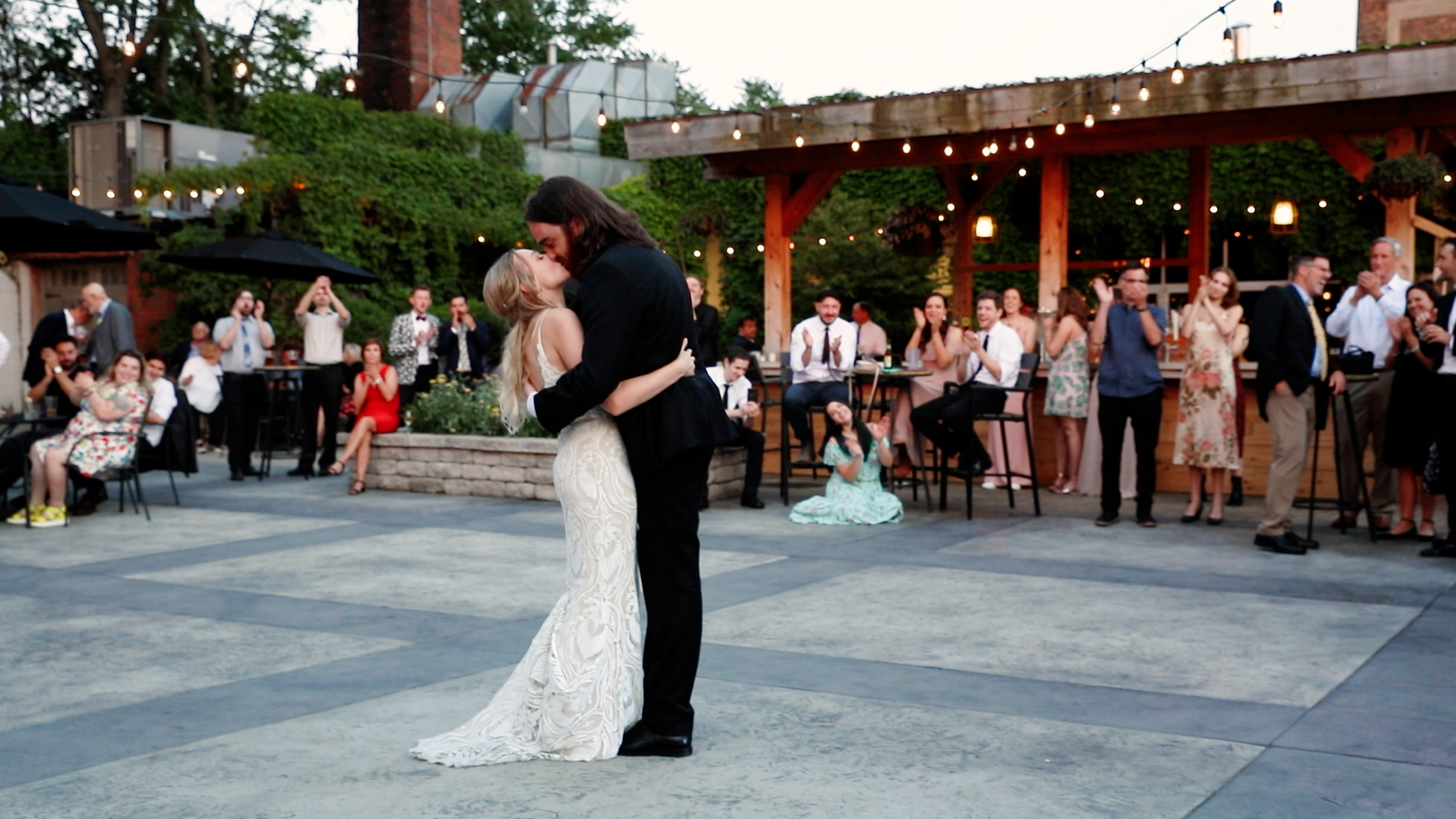 Couple dances to an upbeat first dance song as husband and wife at the Ivy House in Milwaukee