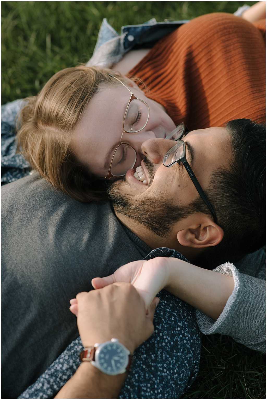 Fond Du Lac WI engagement session - picture of girl kissing man's cheek. Both are wearing glasses.