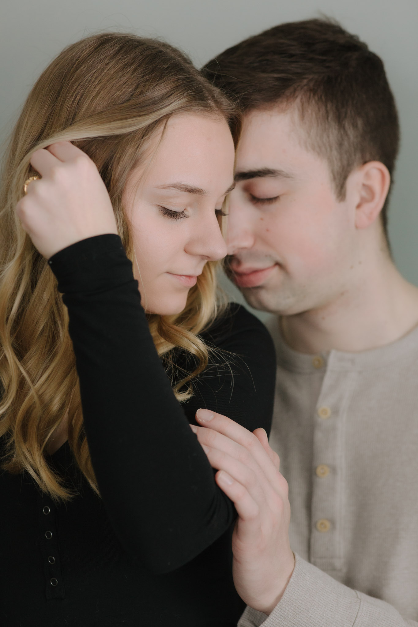 Couple standing on ladder for engagement pictures - creative engagement couples portraits