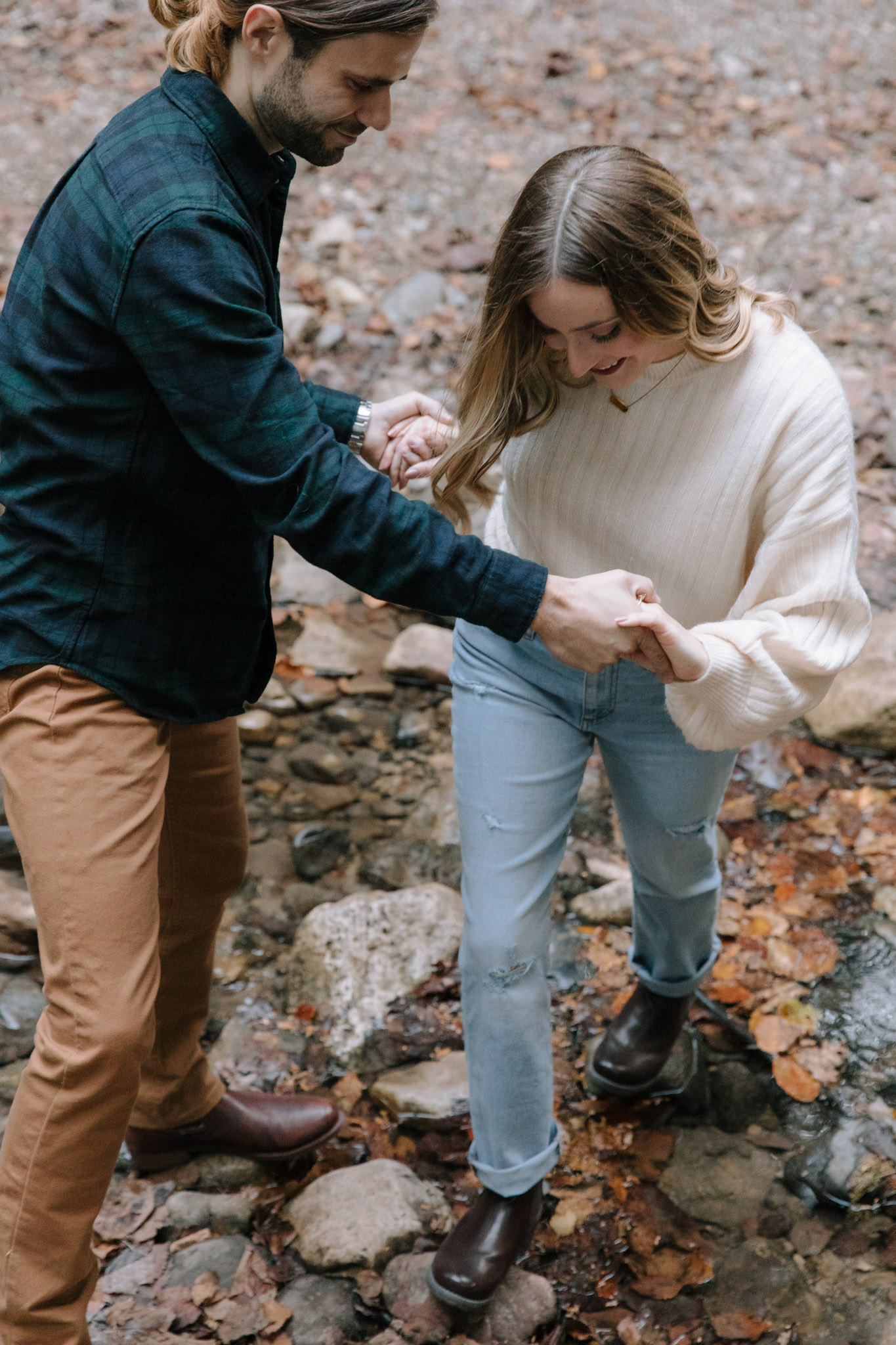 Adventurous Milwaukee engagement session - climbing across a creek