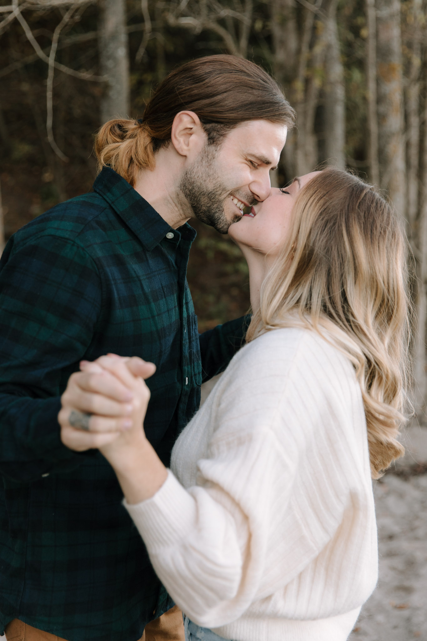 Motion based engagement pictures in Milwaukee, Wisconsin - couple slow dancing on the beach