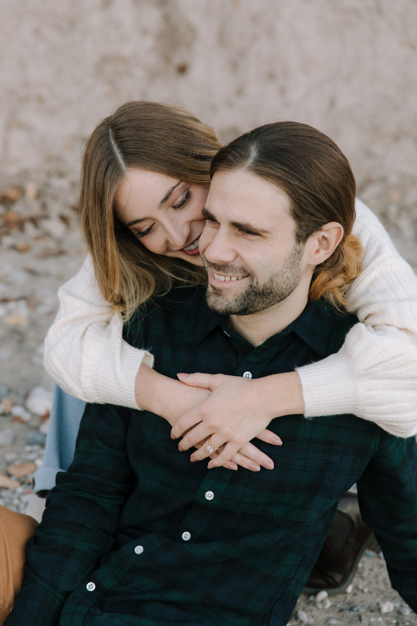 Cute couple engagement photos on the beach of Lake Michigan Milwaukee WI