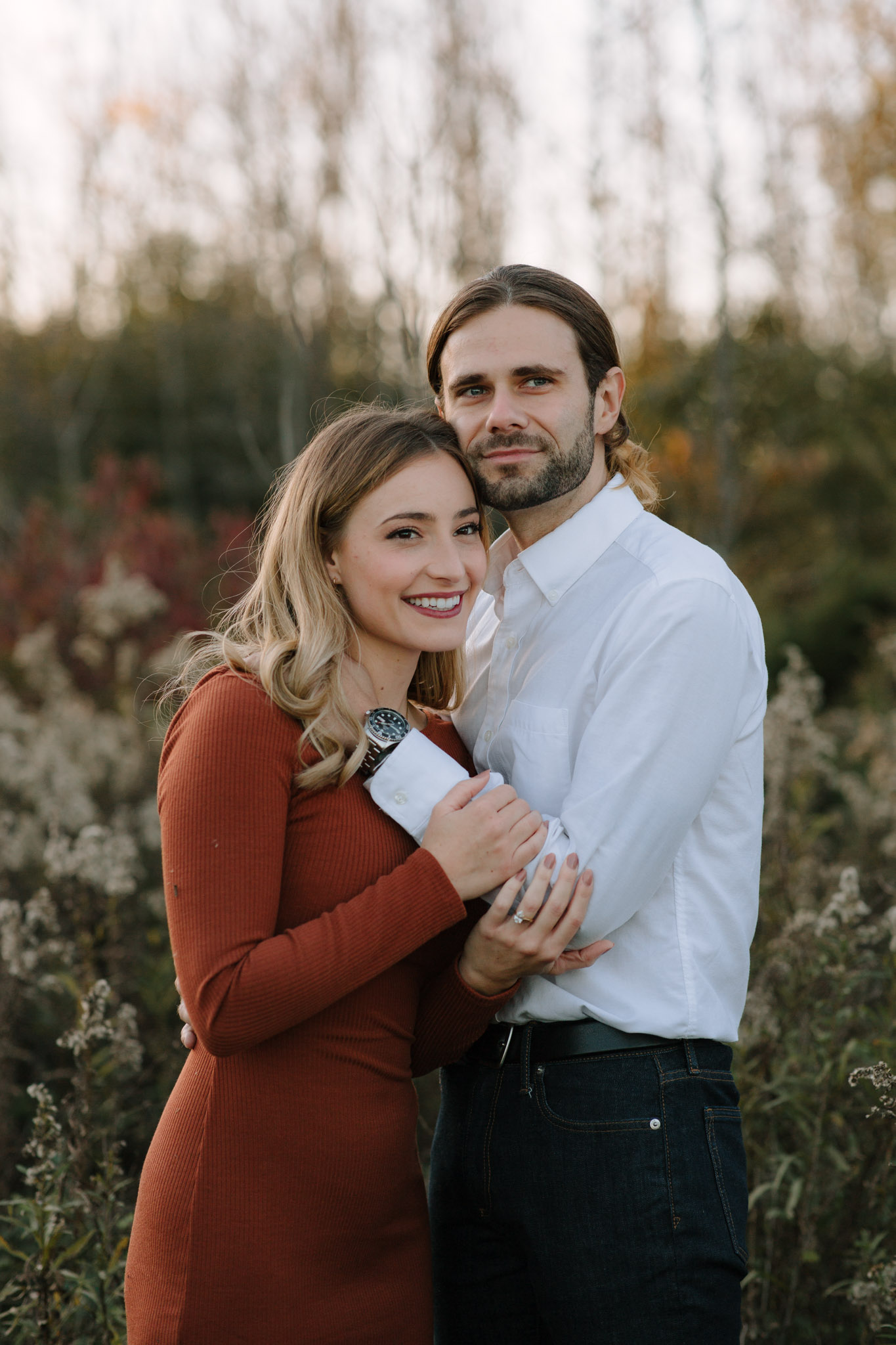 Moody engagement photography in Milwaukee Wisconsin - couple chest to chest staring off into the distance