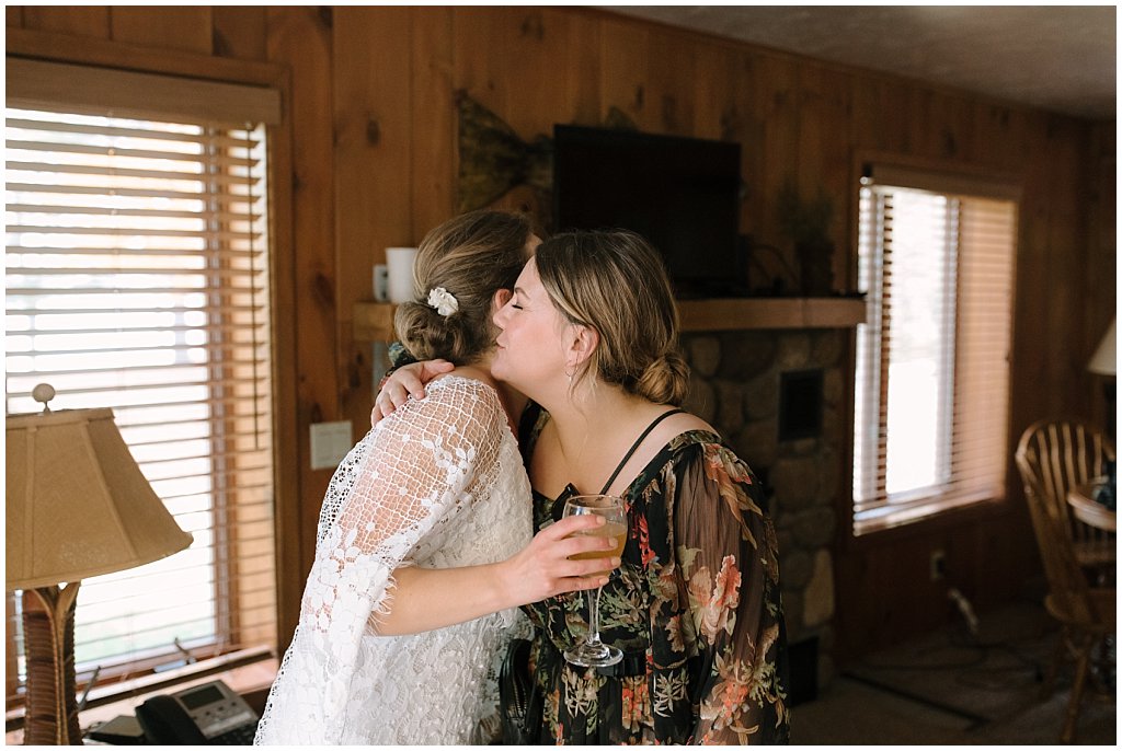 bride hugging sister