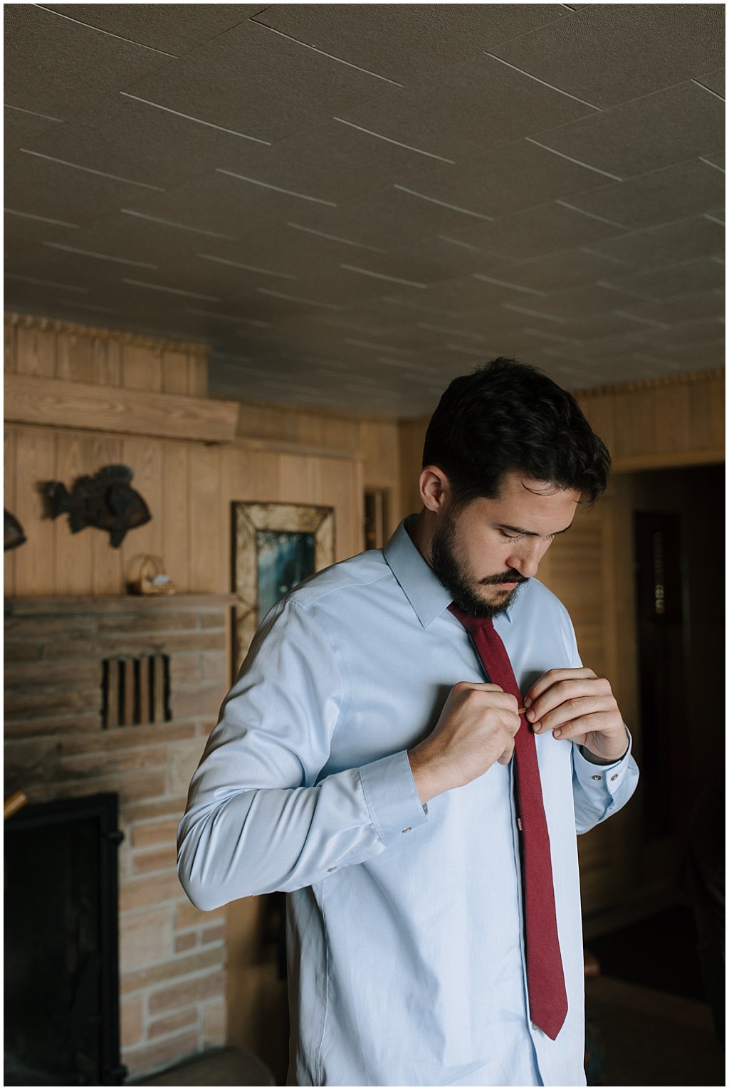 Groom getting ready in cabin 
