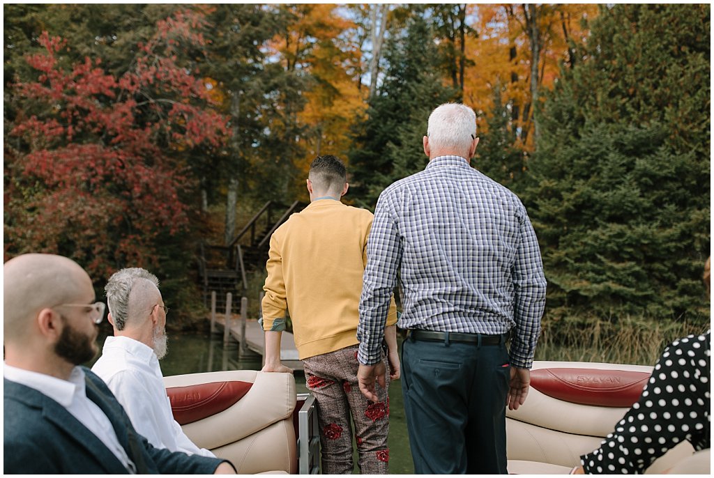 Wedding guests getting off of boat 