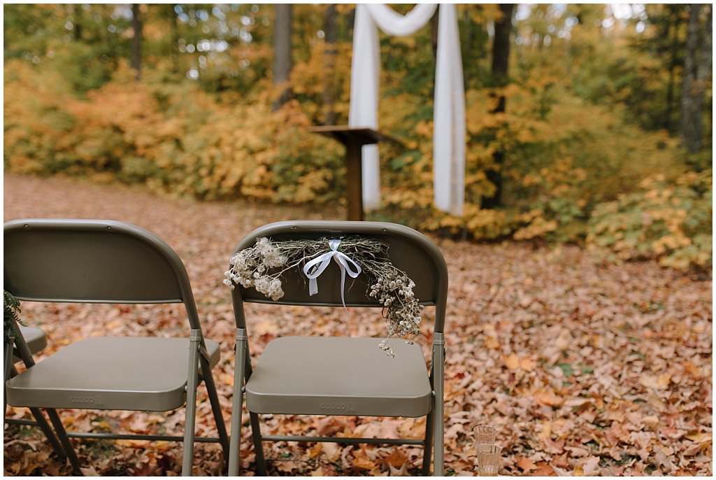 Foraged wedding decor on chairs - unique camp wedding inspiration in Northwoods of Wisconsin