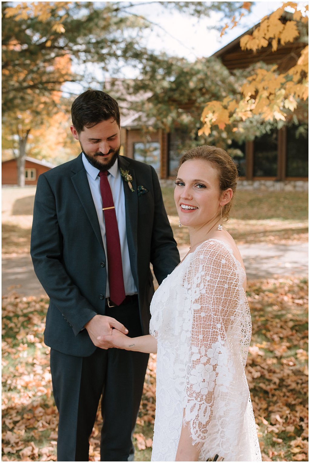Grace Loves Lace wedding dress - 0 foraged boutonniere - navy suit - floral pocket square - unique camp wedding vibes