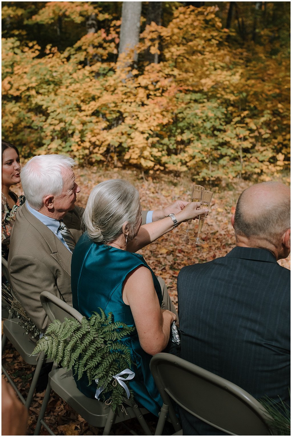 Parents champagne toast during ceremony - Wedding photos - unique camp wedding inspiration in Northwoods of Wisconsin