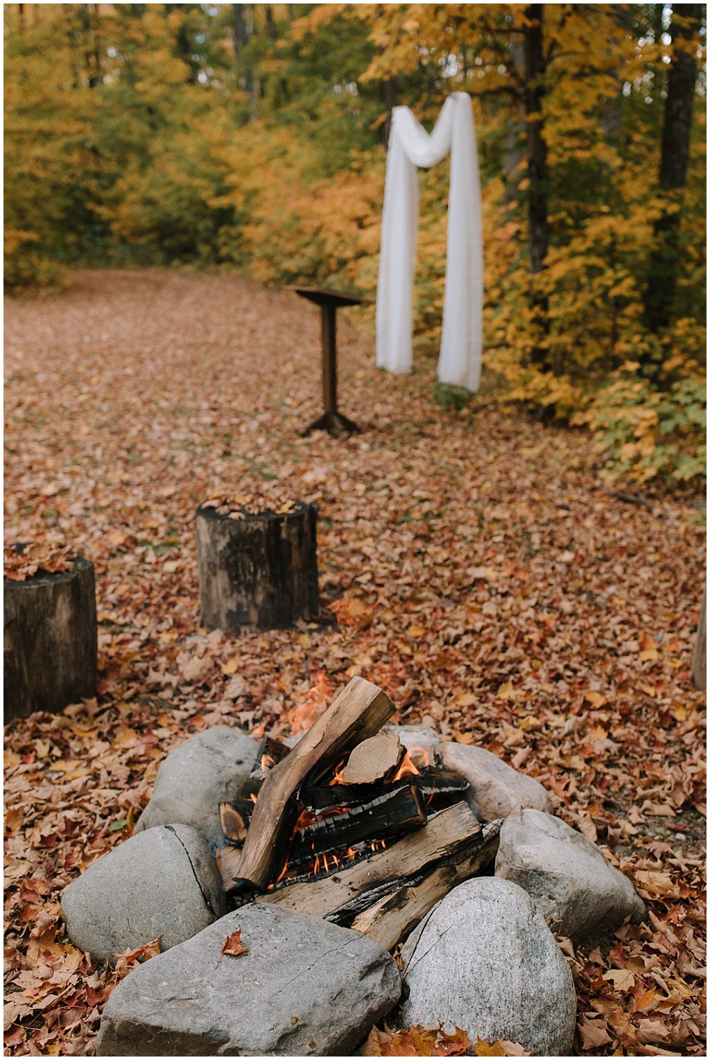 Bonfire at unique camp wedding ceremony 