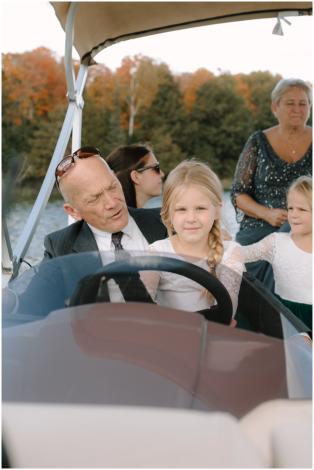 boat cocktail hour booze cruise - unique camp wedding inspiration in Northwoods of Wisconsin on lake with boat