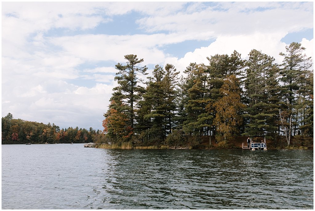 boat cocktail hour booze cruise - unique camp wedding inspiration in Northwoods of Wisconsin on lake with boat