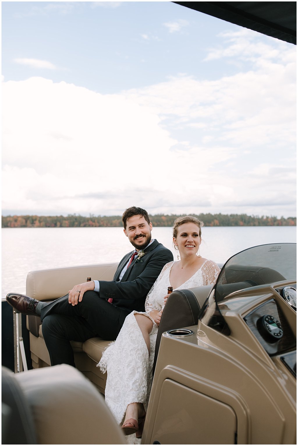 boat cocktail hour booze cruise - unique camp wedding inspiration in Northwoods of Wisconsin on lake with boat