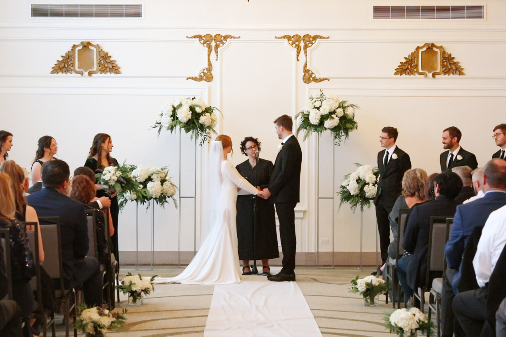 Wedding ceremony at Hotel Northland  - timeless white flowers, gold details