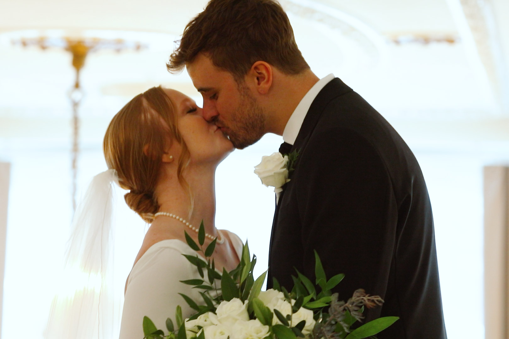 Couple kissing during first look