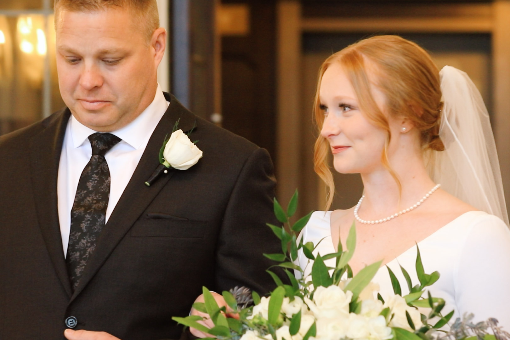 Father walking the bride down the aisle