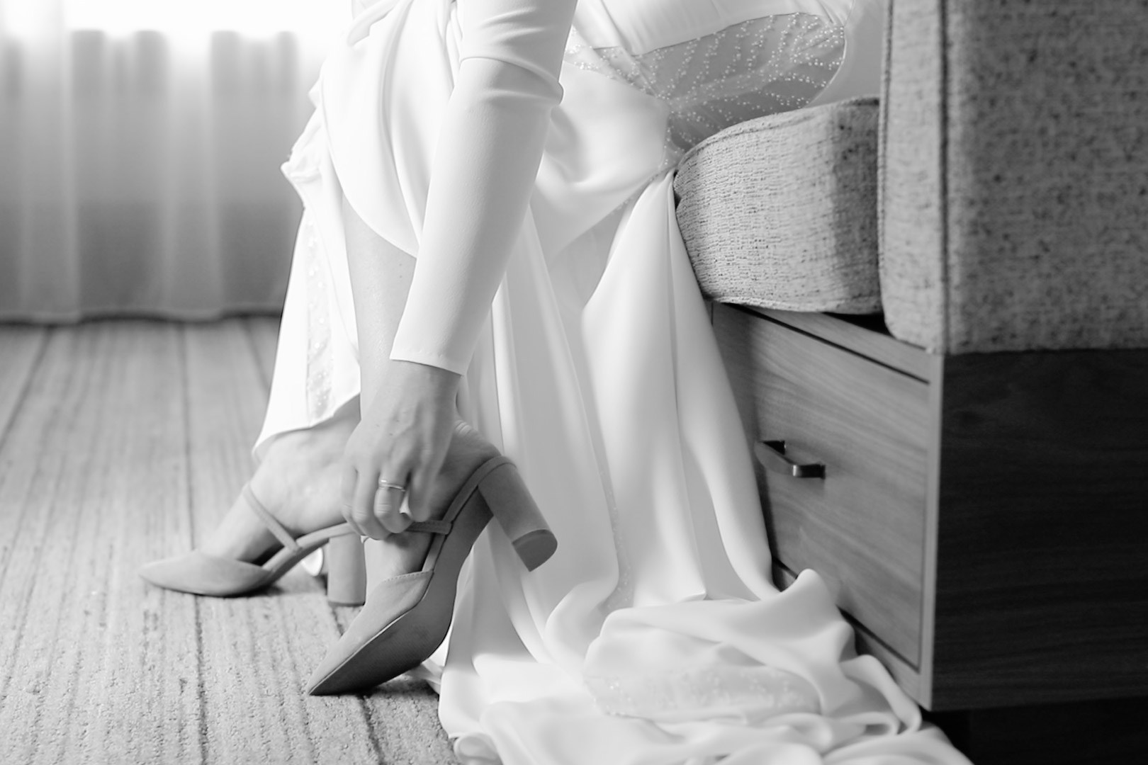 Bride putting on her shoes