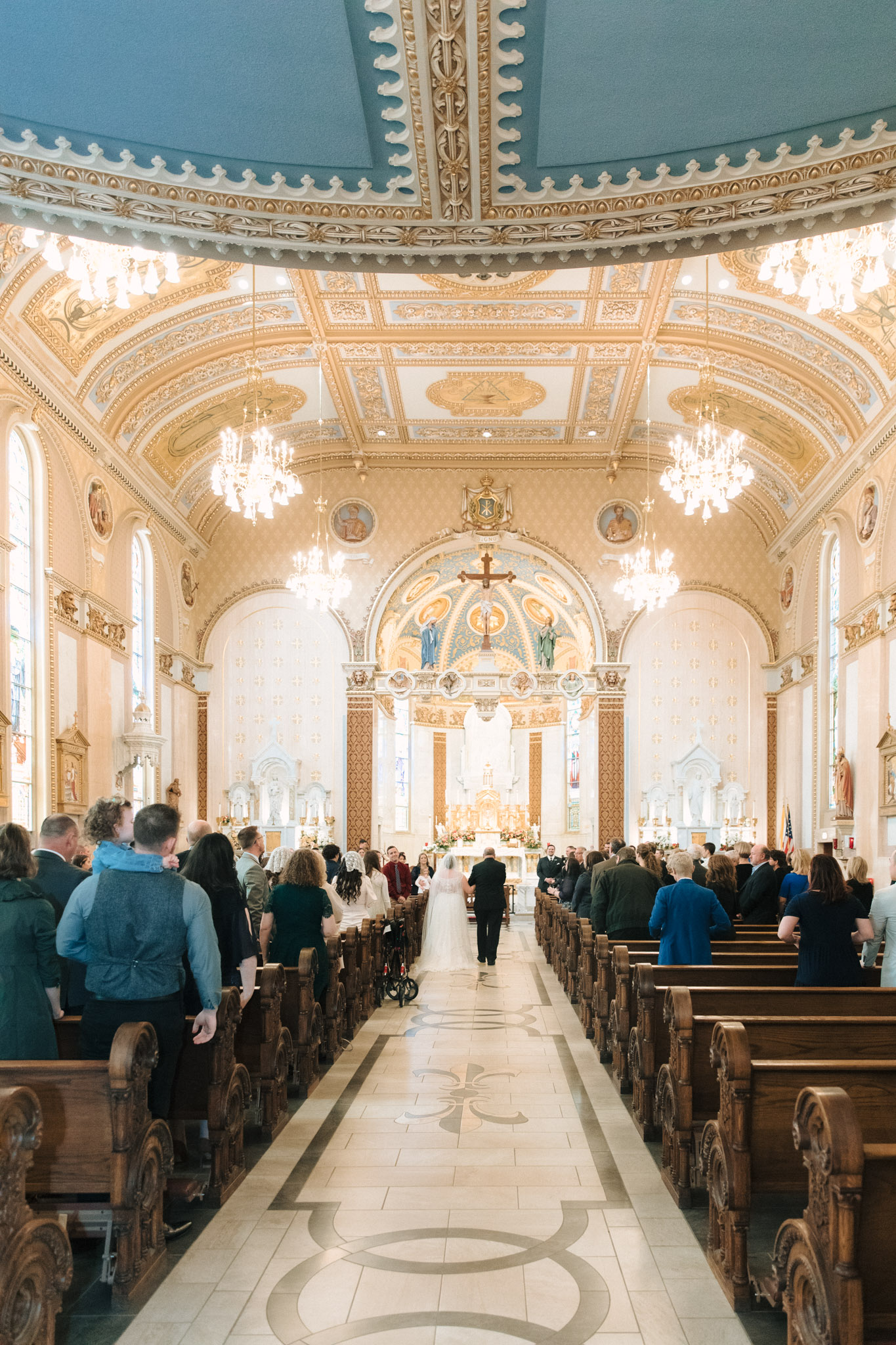 View of the full chapel with the bride walking down the aisle - St Stanislaus wedding