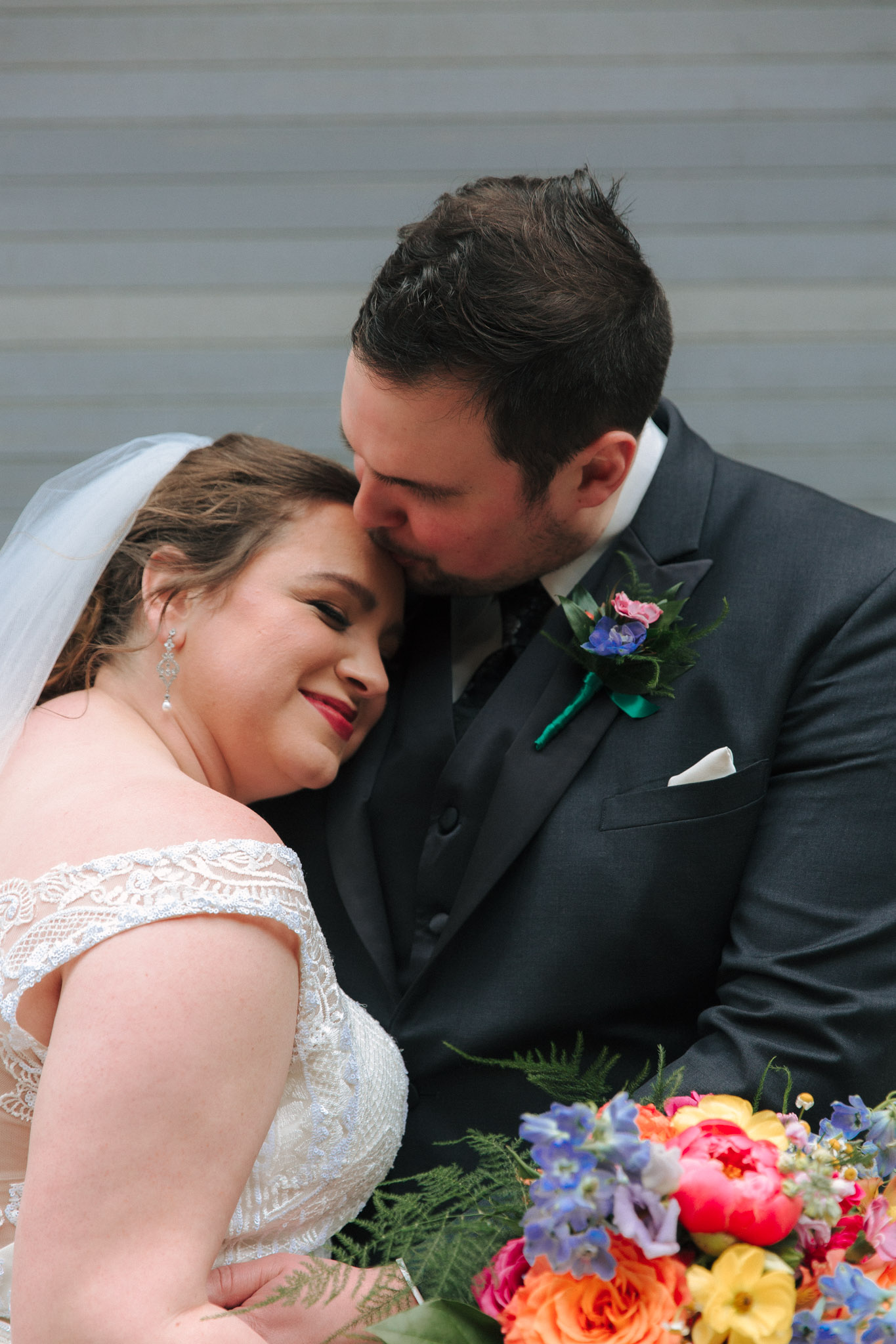 Bride and groom wedding pictures outside of Pabst Theatre