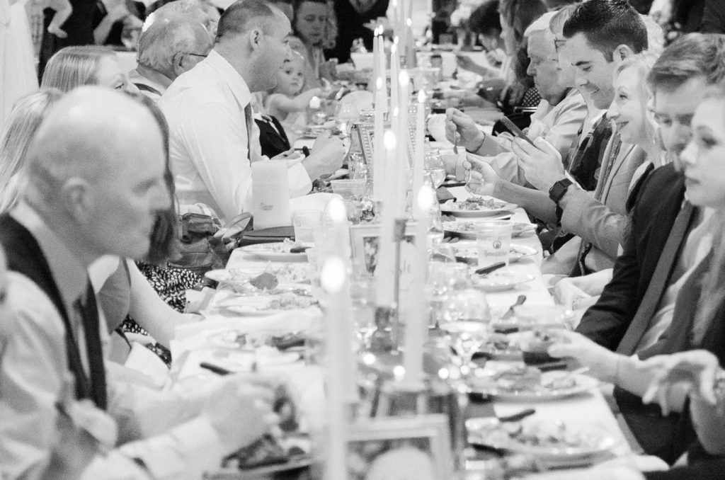 Wedding guests eating candlelit dinner - Sixth Floor Milwaukee