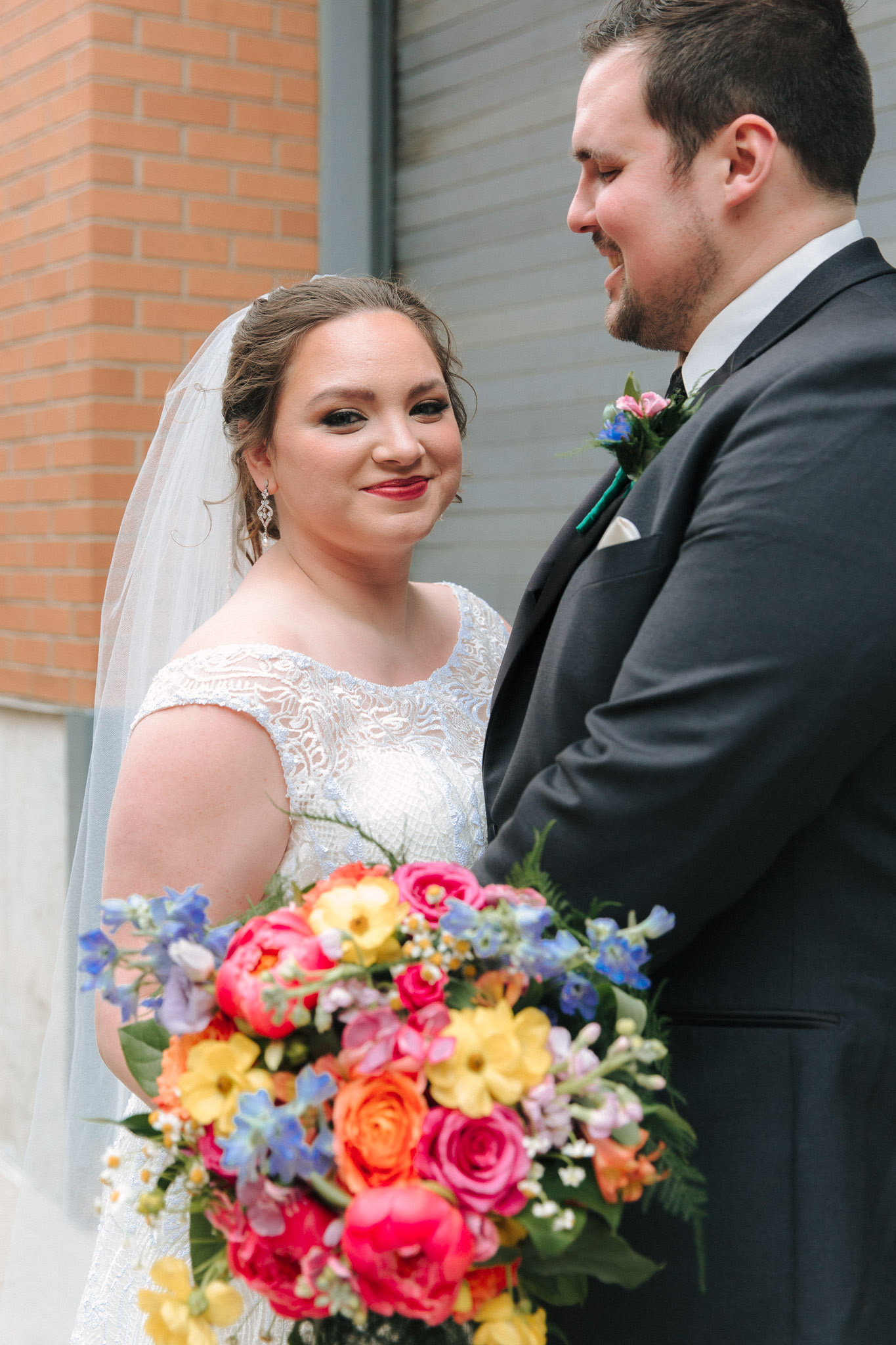 Bride and groom wedding pictures outside of Pabst Theatre