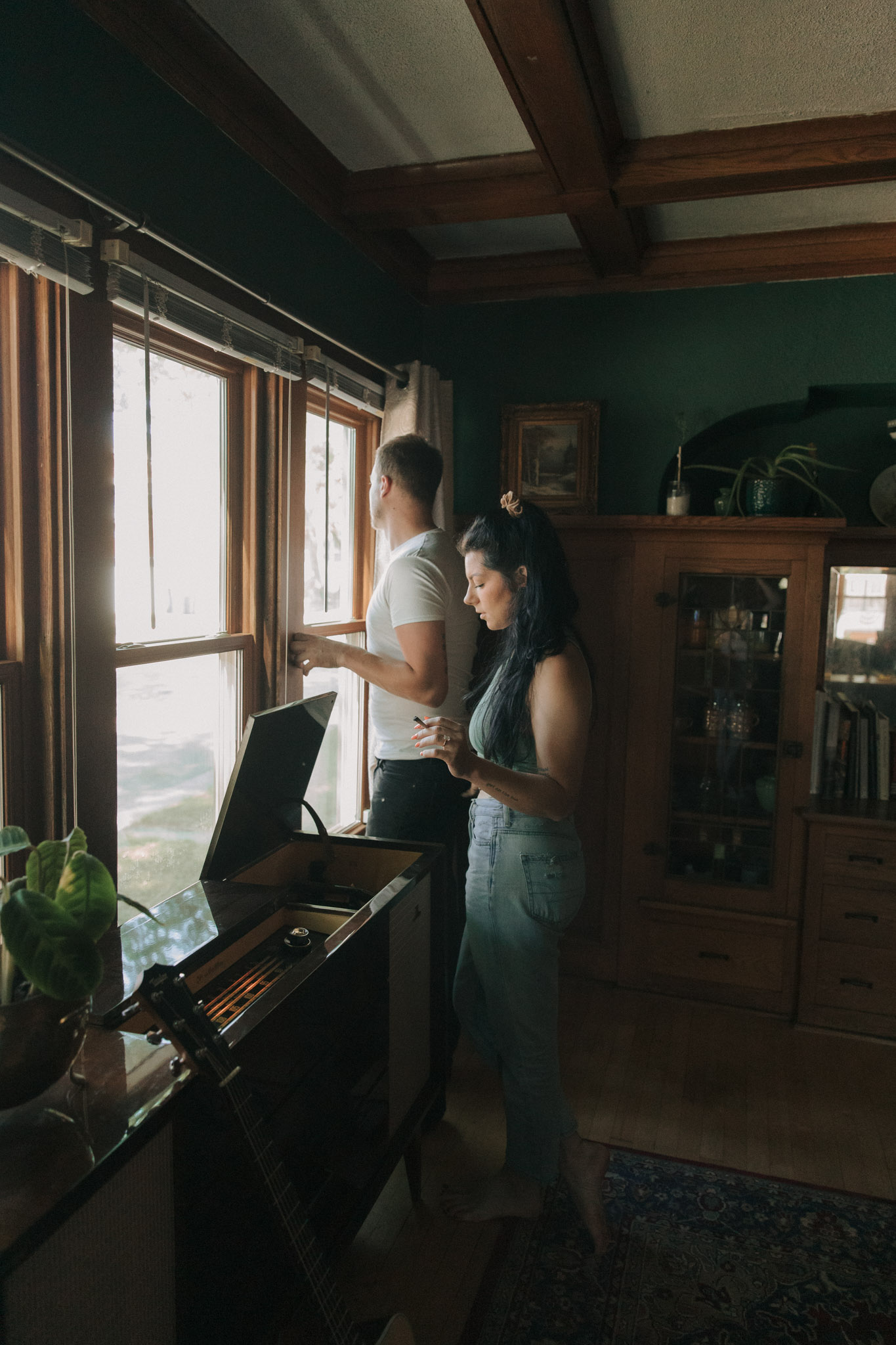 Retro 1960s inspired engagement photos with a blunt, record player, and guitar