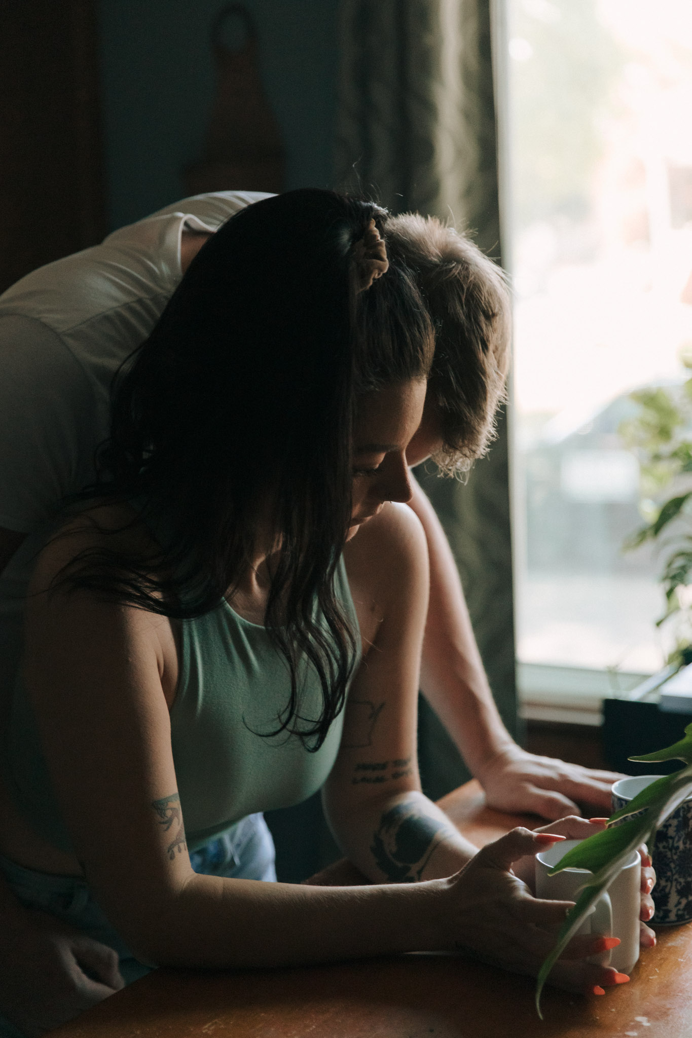 Milwaukee engagement photographers making coffee together during an in home engagement session