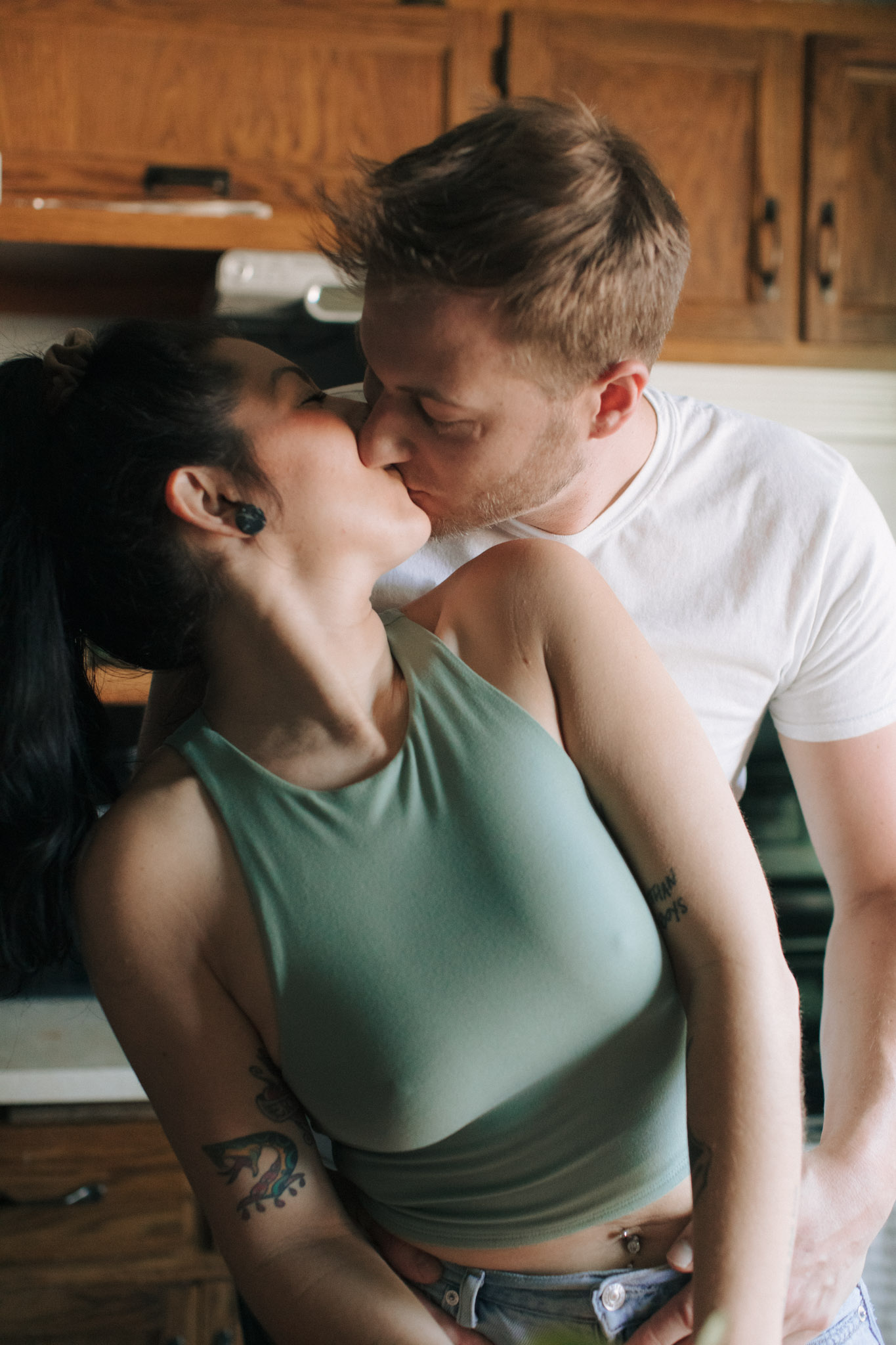 Couple kissing in the kitchen