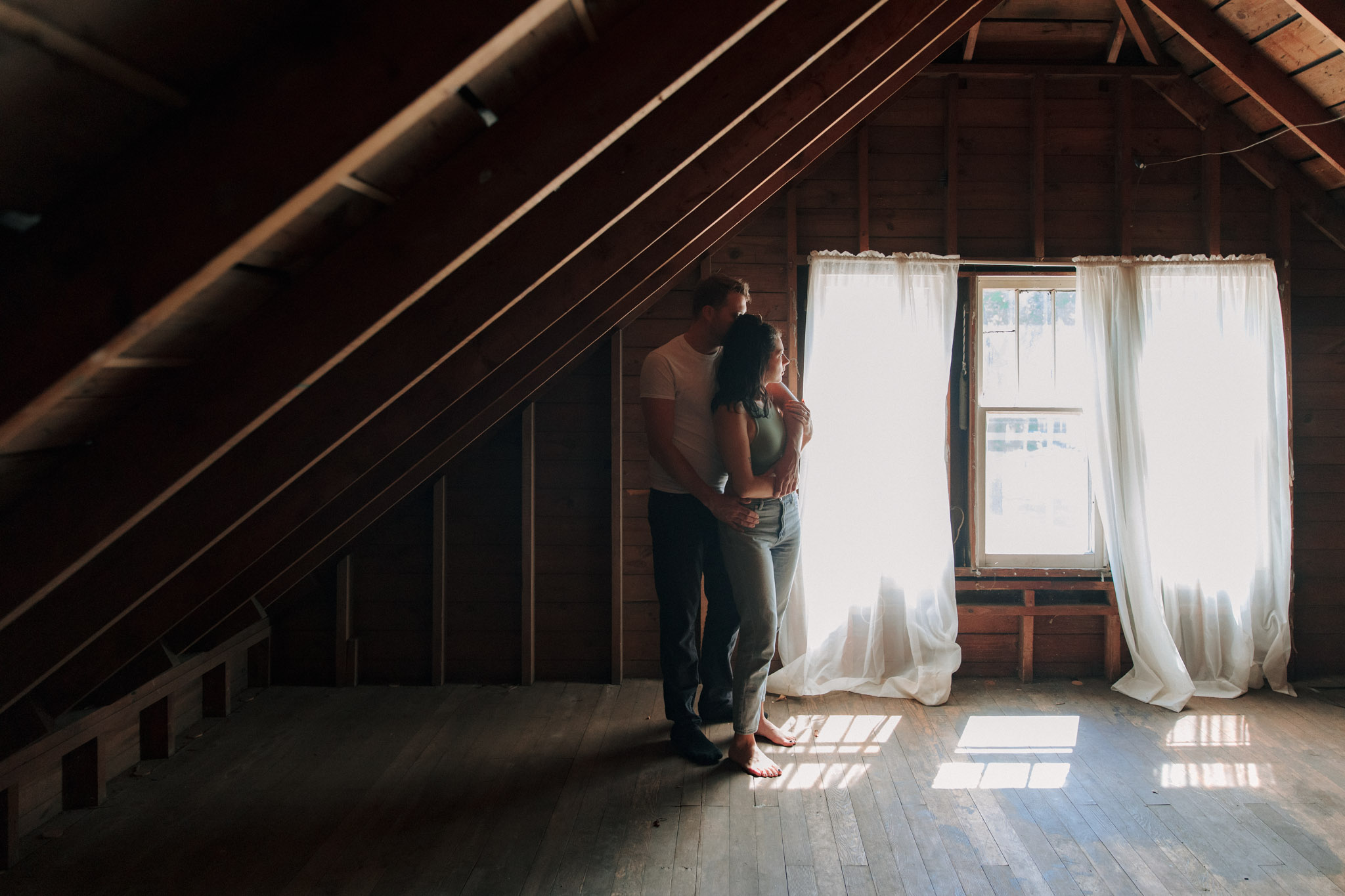 Couple in the attic of their Milwaukee home