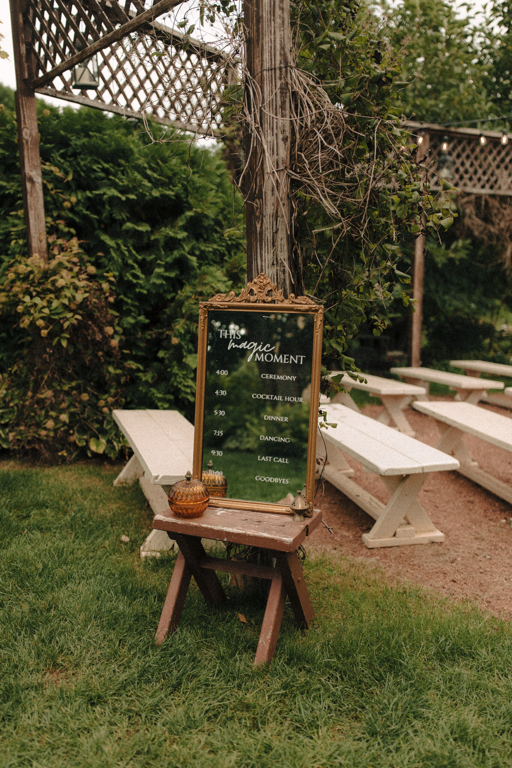 A welcome sign for a garden wedding with bob dylan song lyrics