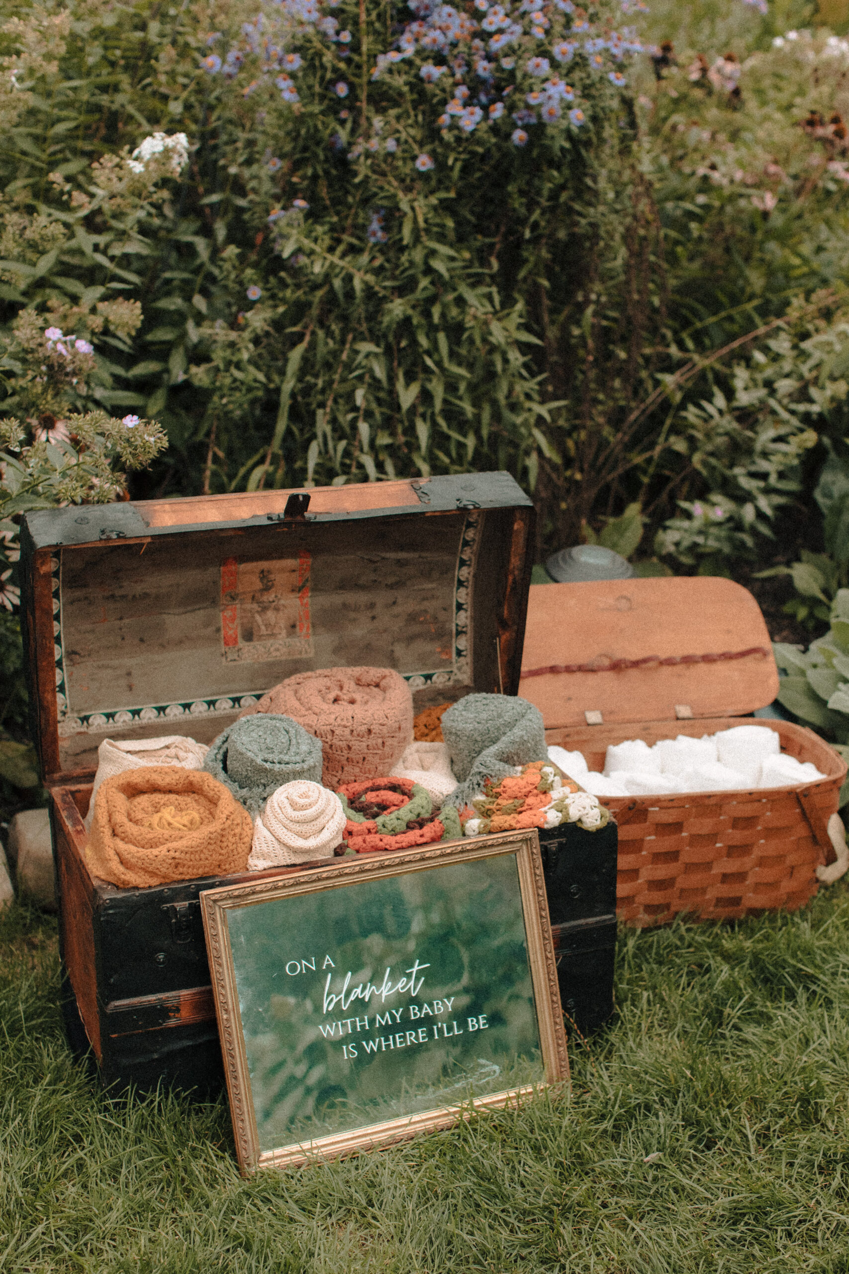 hand crocheted afghan throw blankets in a vintage trunk for wedding guests who get cold