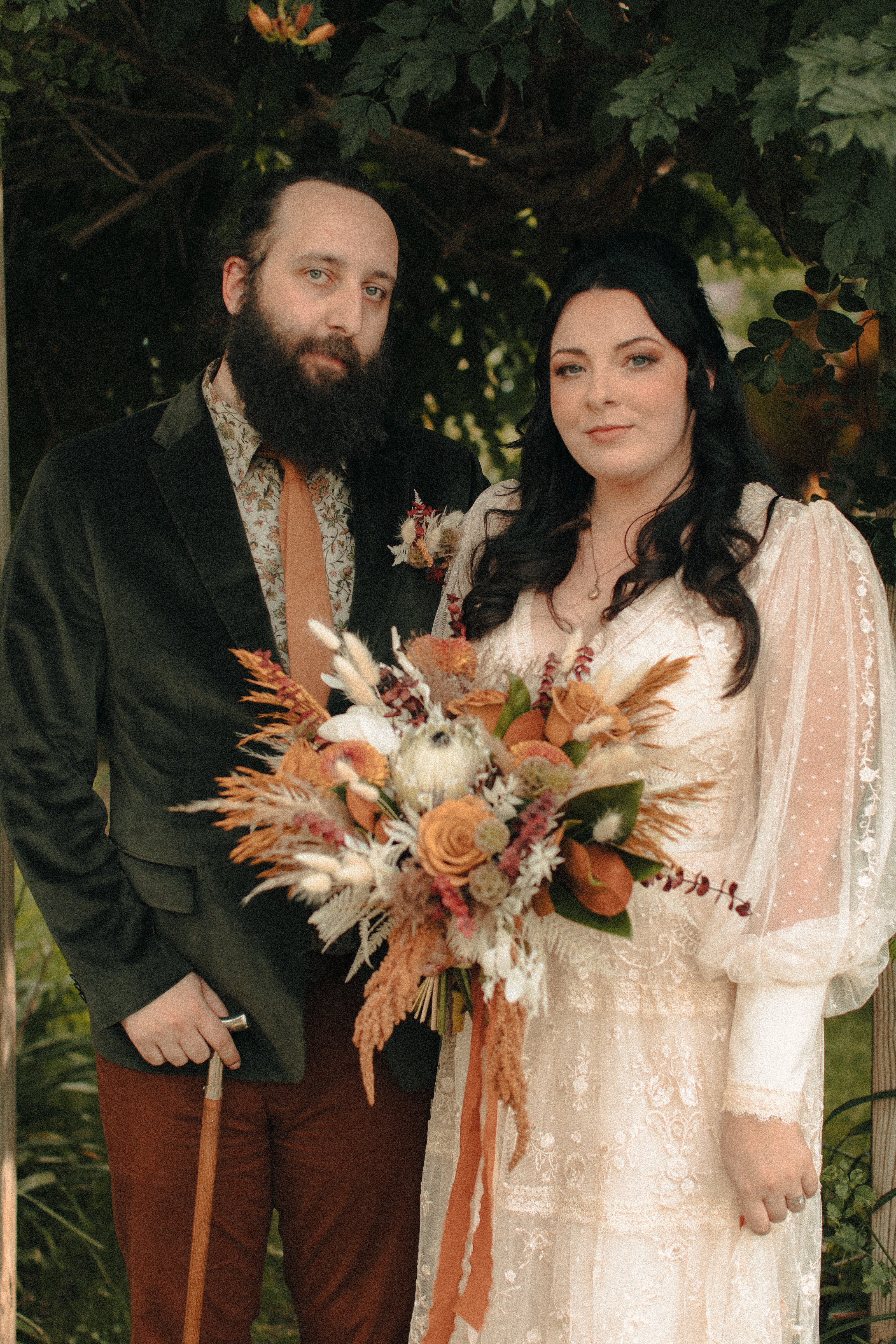 Vintage hipster couple posing for a photo on their wedding day