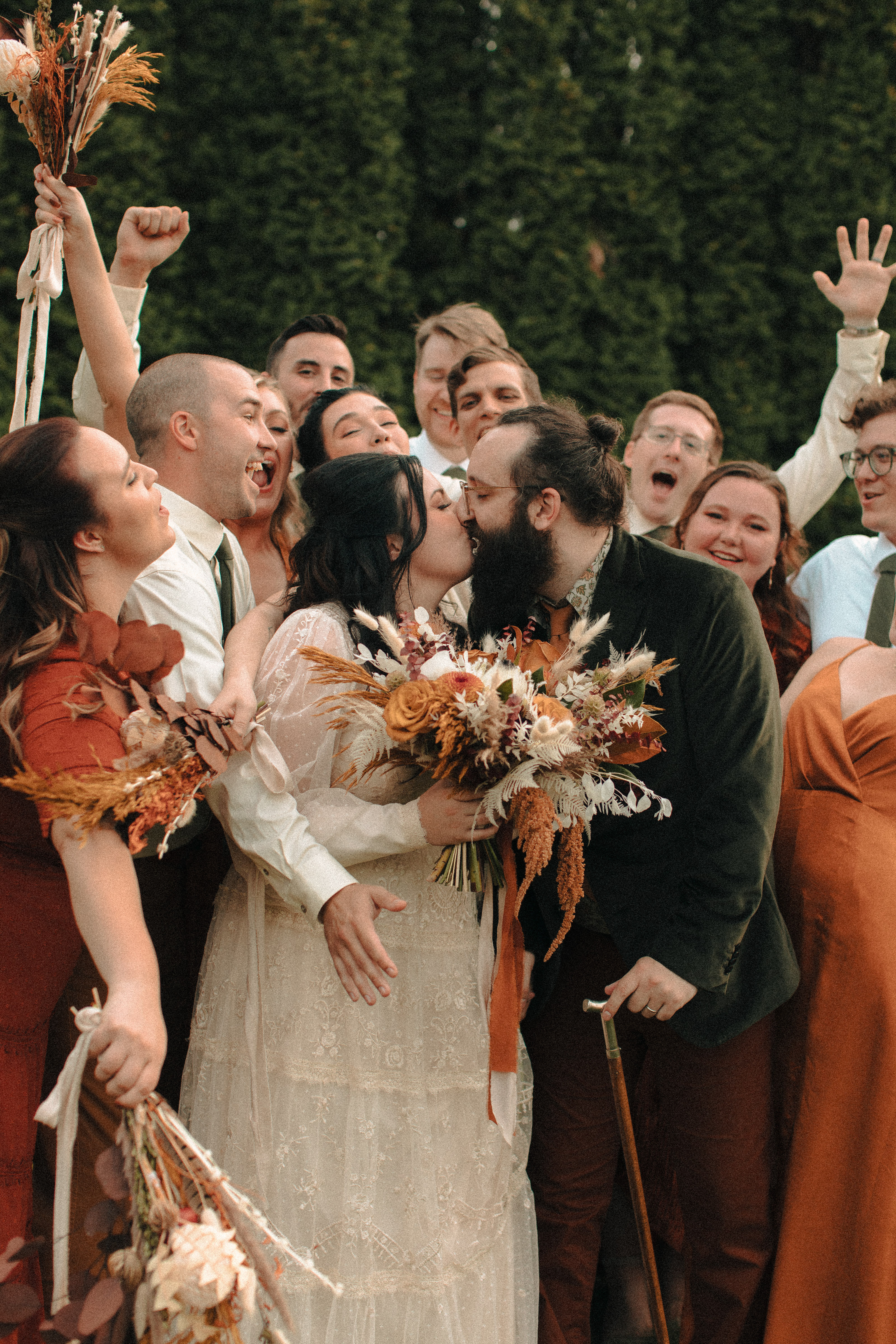 Wedding party cheering on a newly married couple at The Gardens Wedding Center in Allentown, Wisconsin