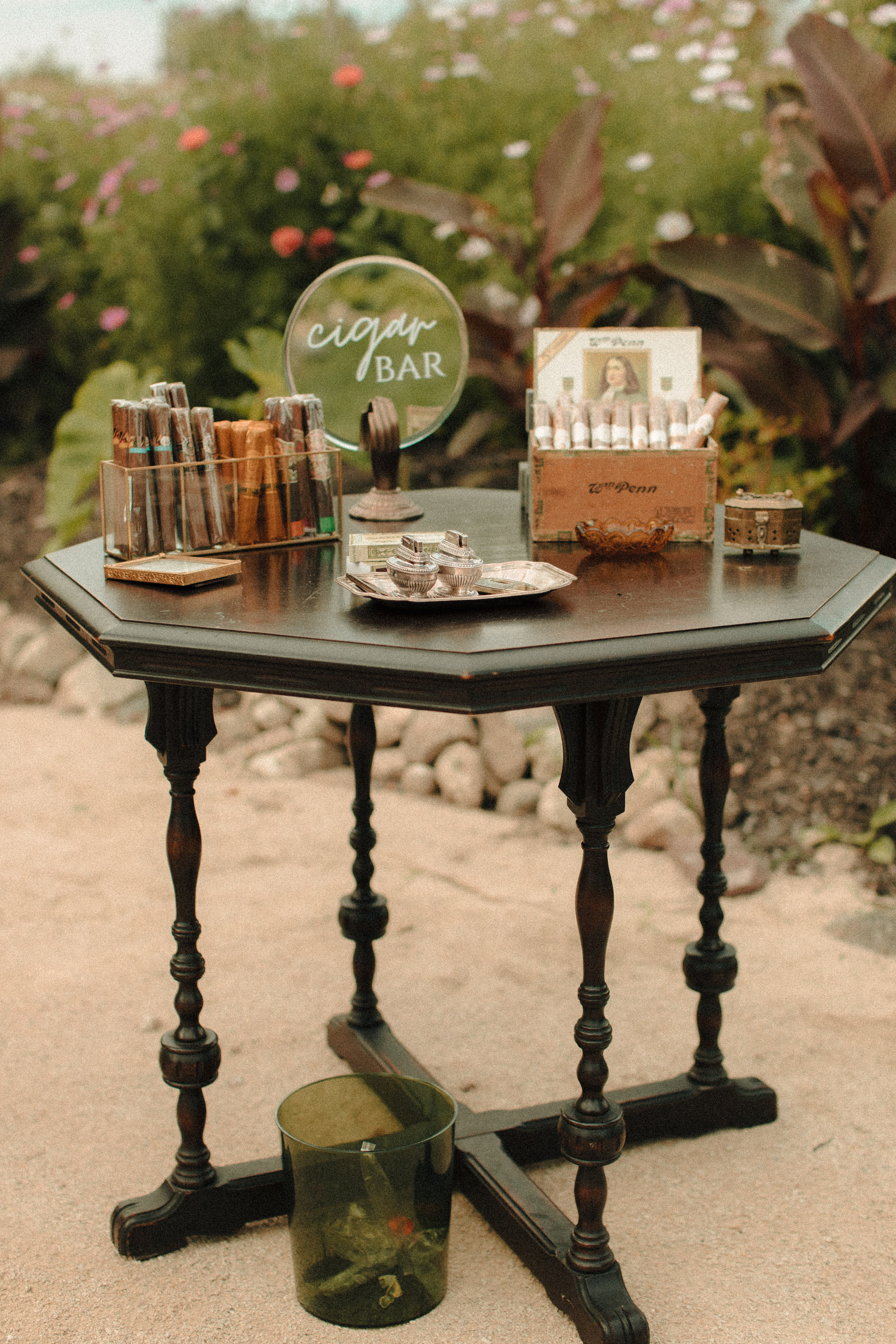 Speakeasy inspired cigar bar at a wedding with vintage lighters