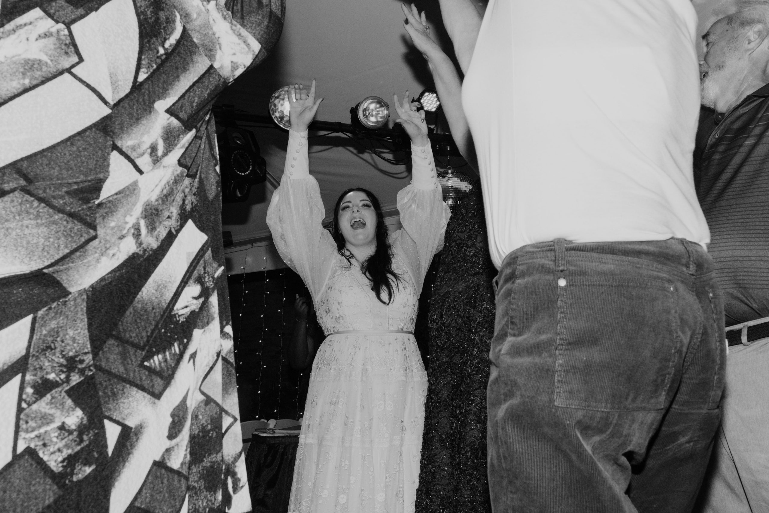 Bride dancing under a disco ball